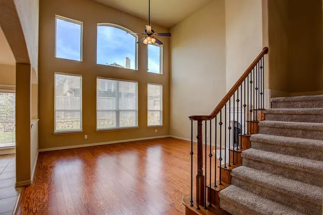 a view of an entryway with wooden floor