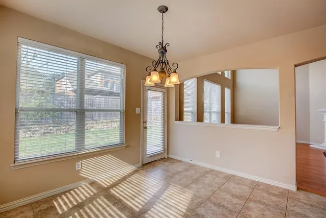 a view of a room with large windows