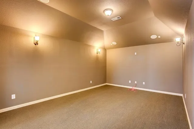 an empty room with furniture and closet