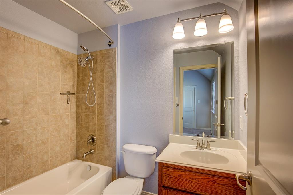 9017 Hawley Drive Fort Worth, TX 76244 - Photo 32 of 40 a bathroom with a sink tub shower and a mirror