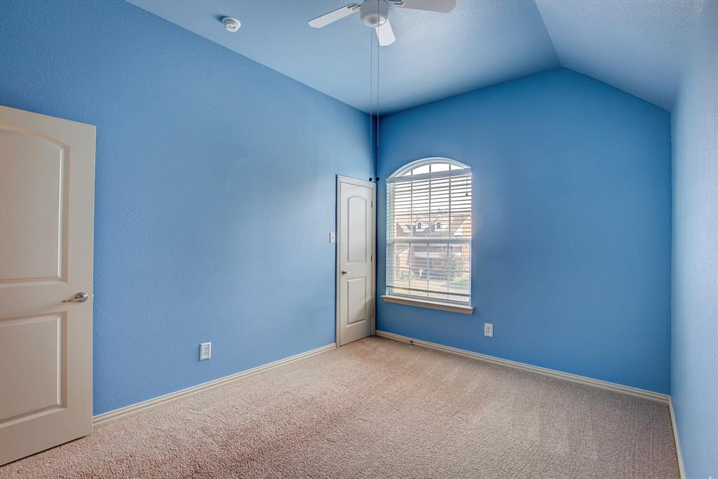 9017 Hawley Drive Fort Worth, TX 76244 - Photo 36 of 40 an empty room with a window and a ceiling fan