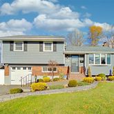 a front view of house with a yard