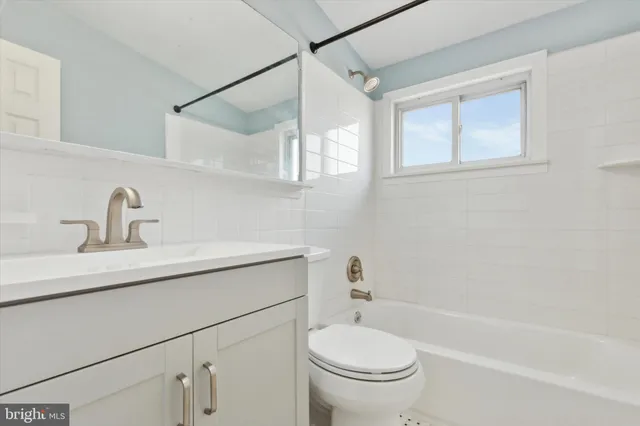 a bathroom with a sink a toilet and a bathtub