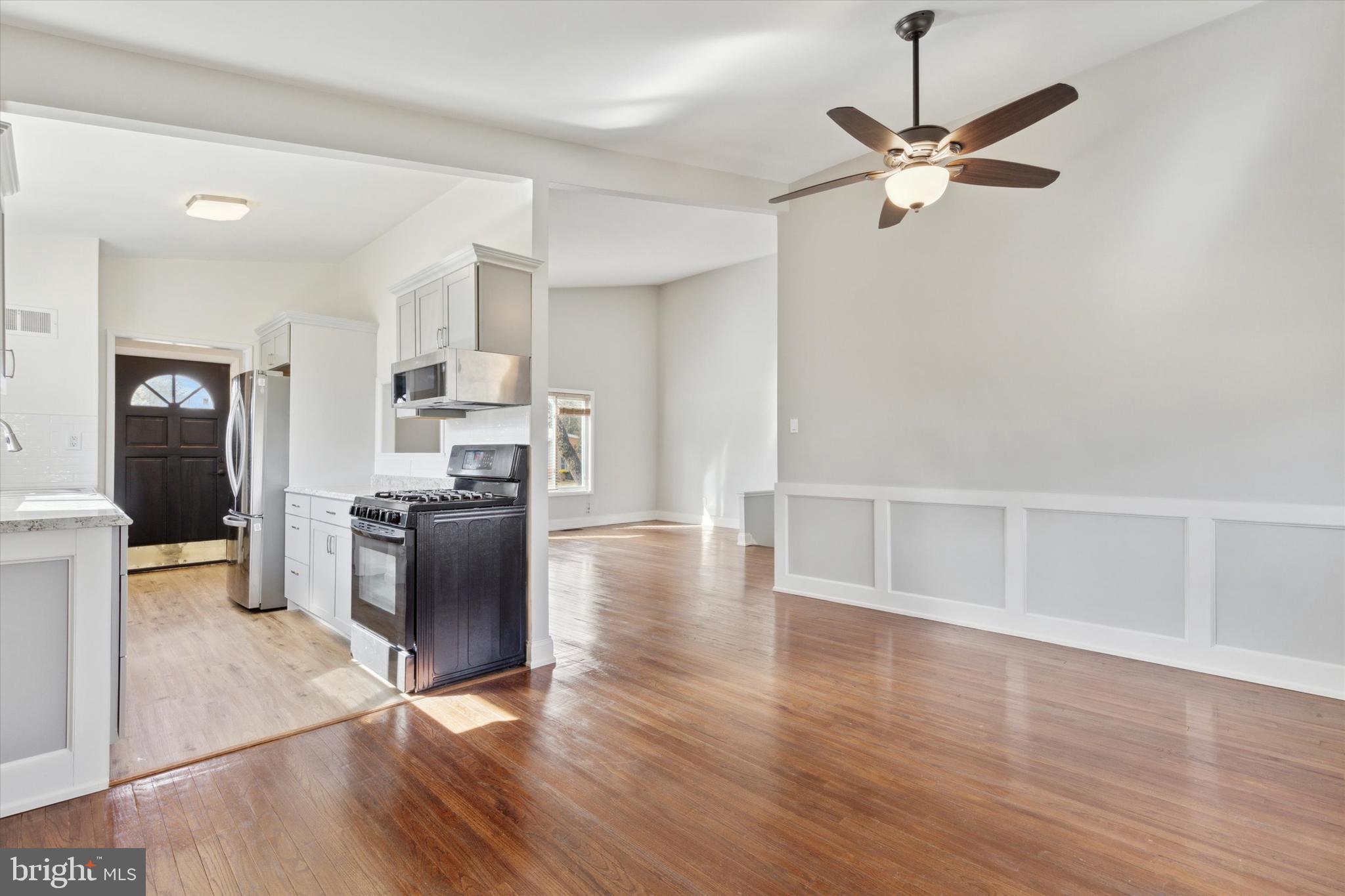 1633 Pulaski Drive Blue Bell, PA 19422 - Photo 5 of 13 a view of a kitchen with a sink a refrigerator and wooden floor