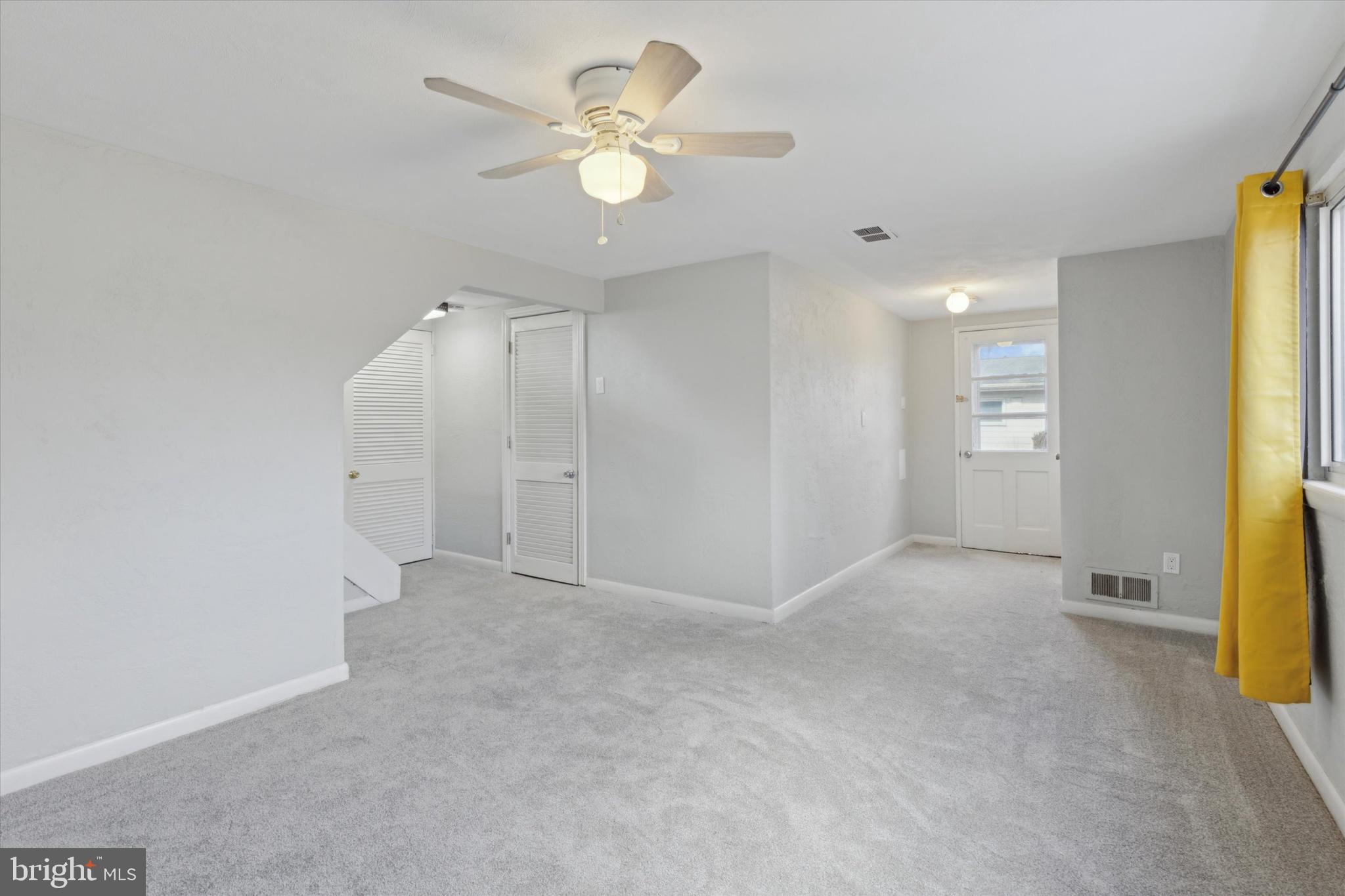 1633 Pulaski Drive Blue Bell, PA 19422 - Photo 7 of 13 an empty room with a bathroom and a chandelier fan