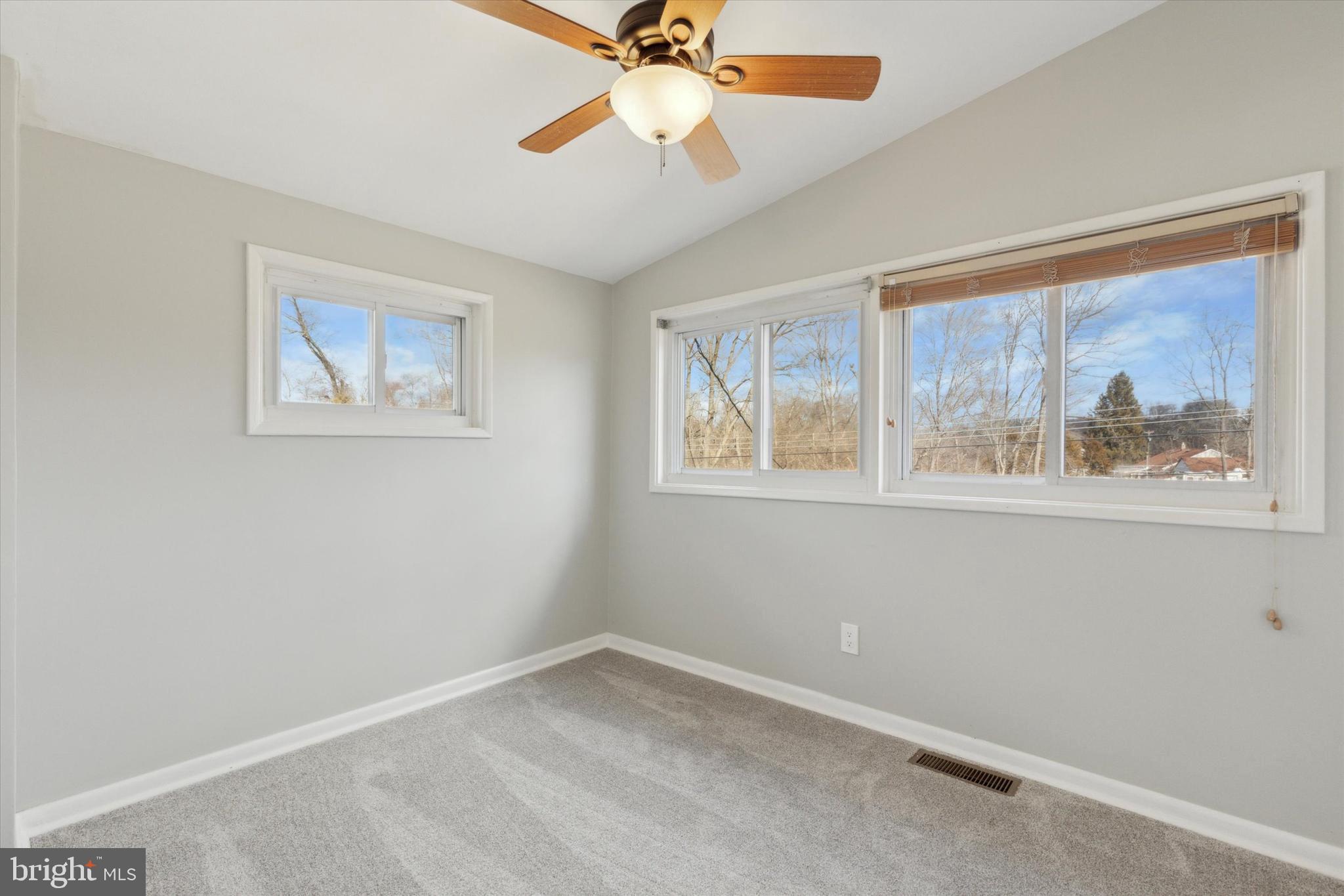 1633 Pulaski Drive Blue Bell, PA 19422 - Photo 9 of 13 a view of empty room with window and ceiling fan
