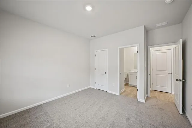 a bathroom with a granite countertop toilet a sink and a bathtub