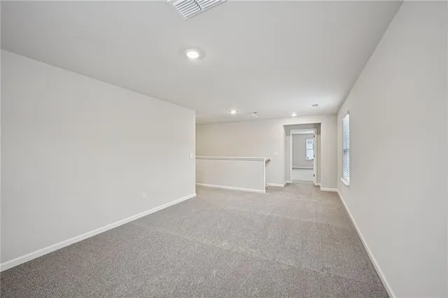 a view of a hallway with closet area