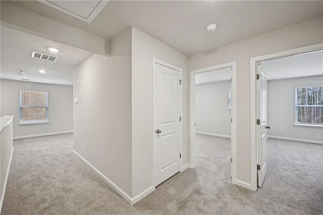 wooden floor with white walls and closet