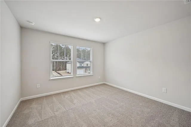a view of an empty room and a window