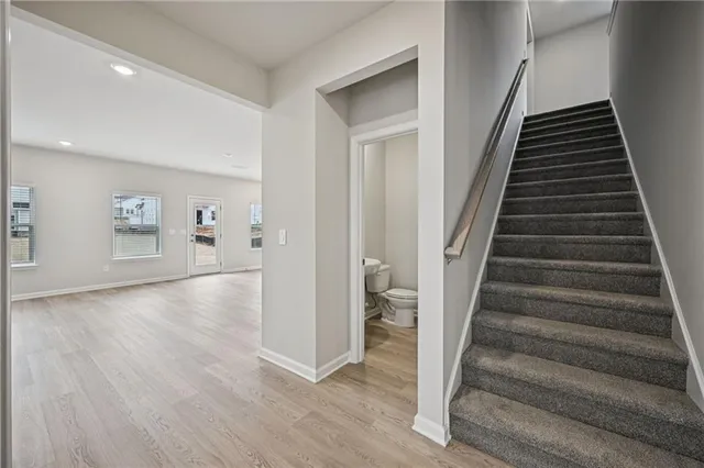 wooden floor in an empty room with a gallery