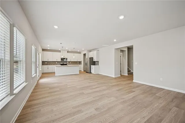 a view of kitchen with wooden floor