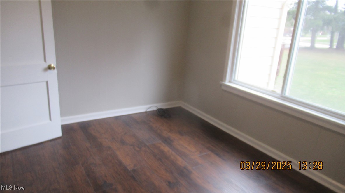 36505 Pettibone Road Solon, OH 44139 - Photo 14 of 24 Unfurnished room with baseboards and dark wood finished floors