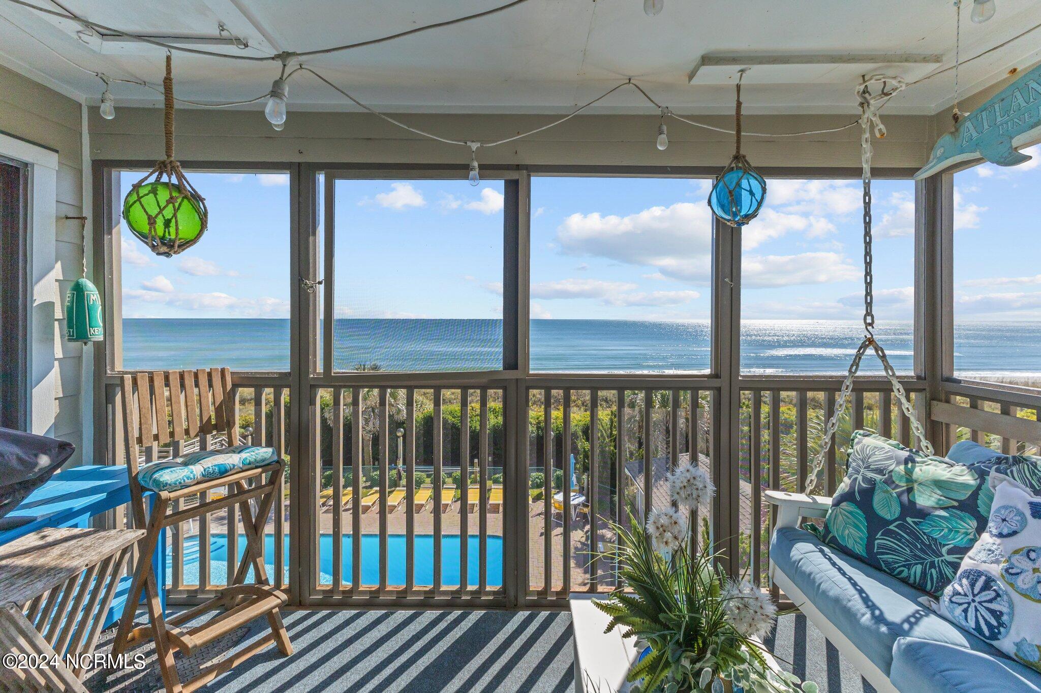 497 Salter Path Road, Unit B22 Pine Knoll Shores, NC 28512 - Photo 13 of 36 Screened in patio
