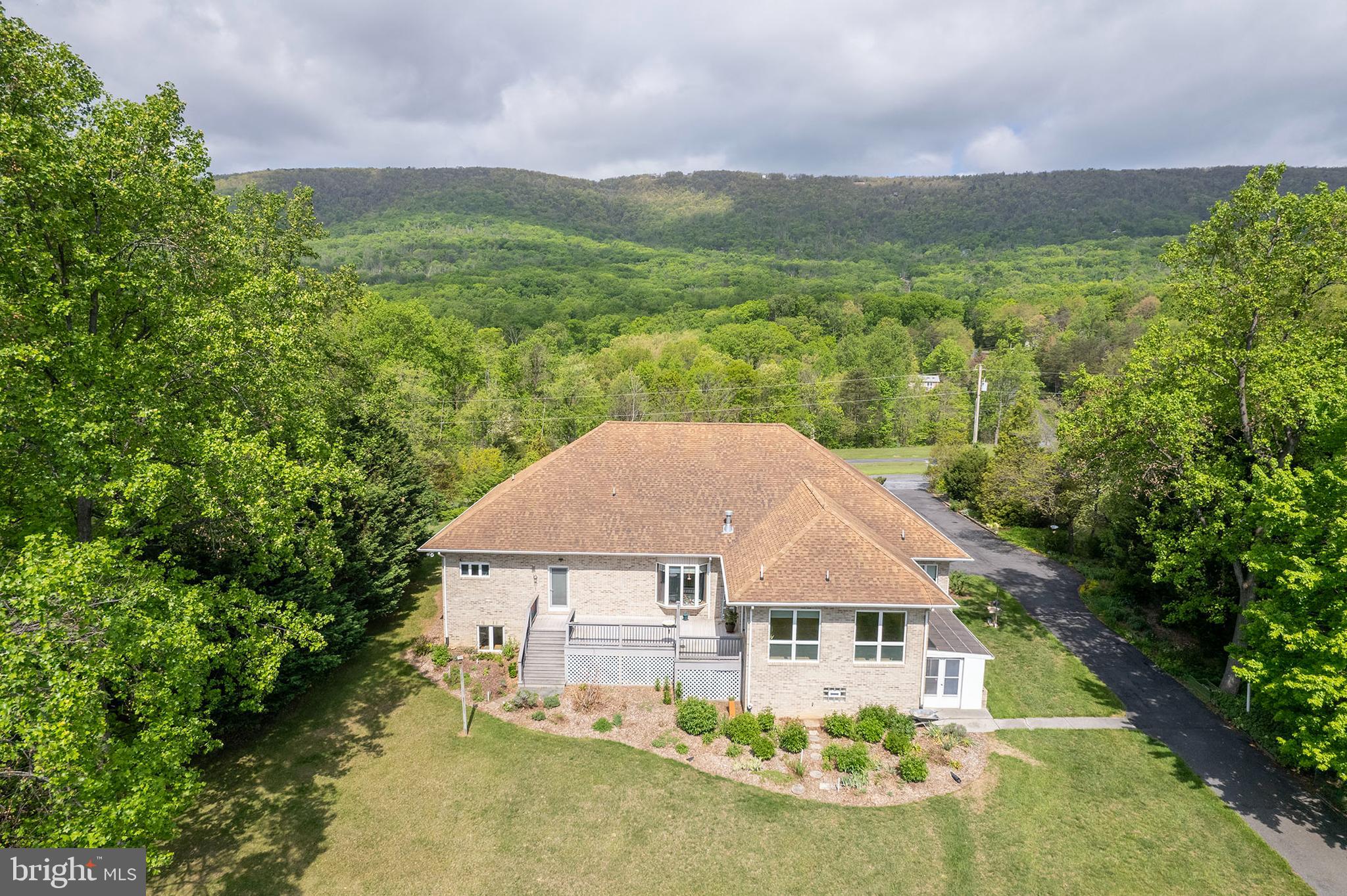237 Aspen Trail Winchester, VA 22602 - Photo 2 of 69 a view of a big house with a big yard plants and large trees
