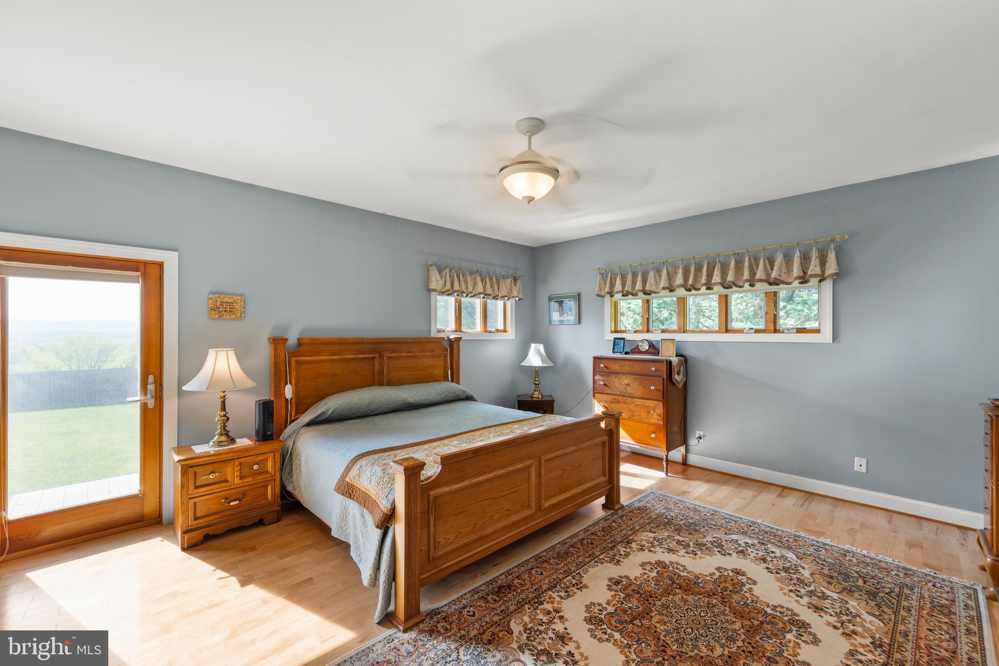 237 Aspen Trail Winchester, VA 22602 - Photo 25 of 69 a bedroom with a bed and wooden floor