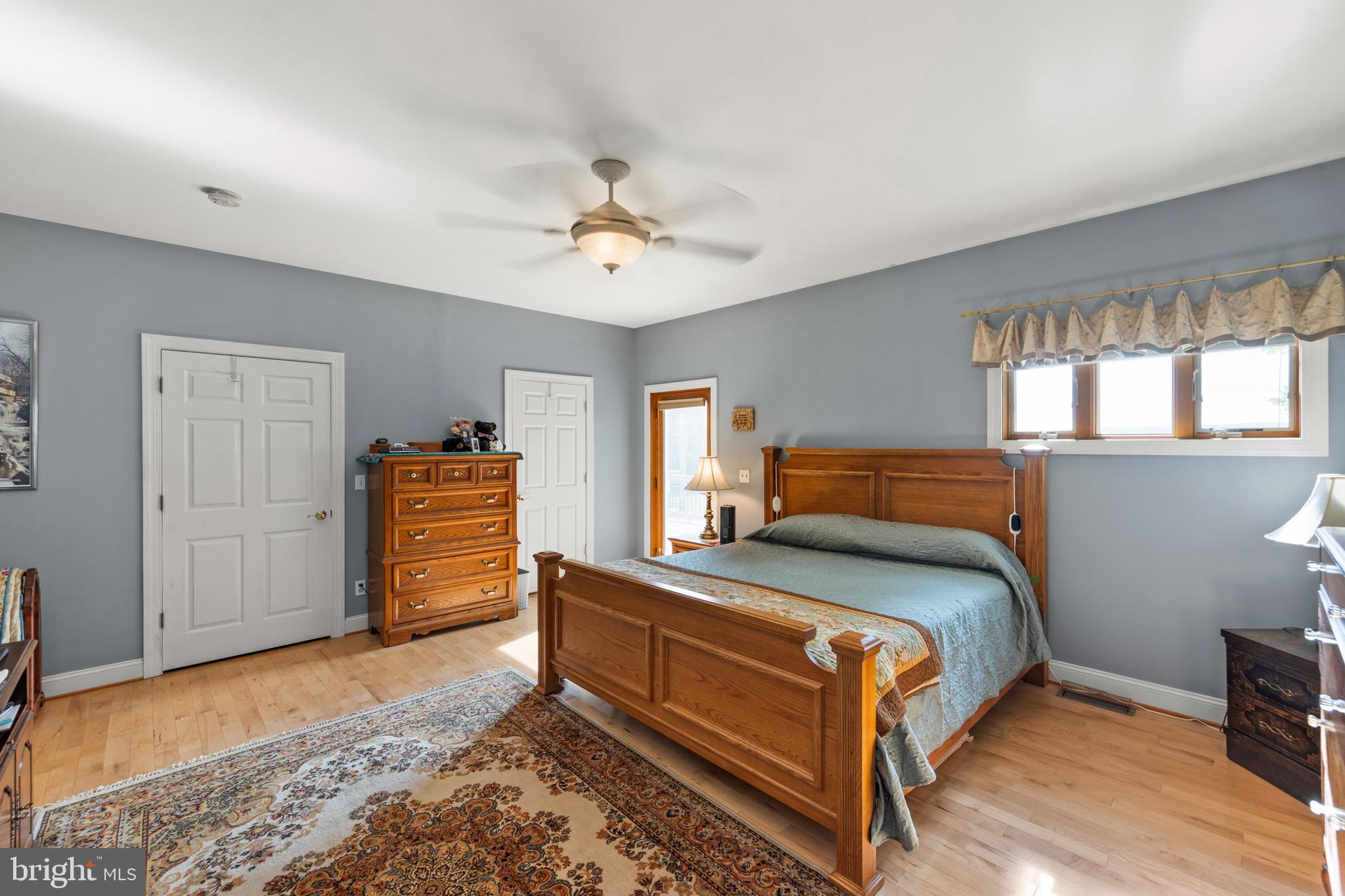 237 Aspen Trail Winchester, VA 22602 - Photo 26 of 69 a bedroom with a bed and a chandelier