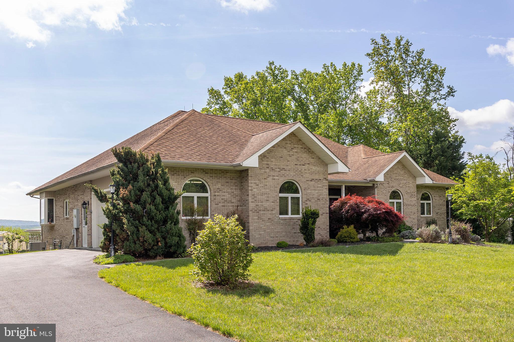237 Aspen Trail Winchester, VA 22602 - Photo 47 of 69 a front view of house with yard and trees in the background