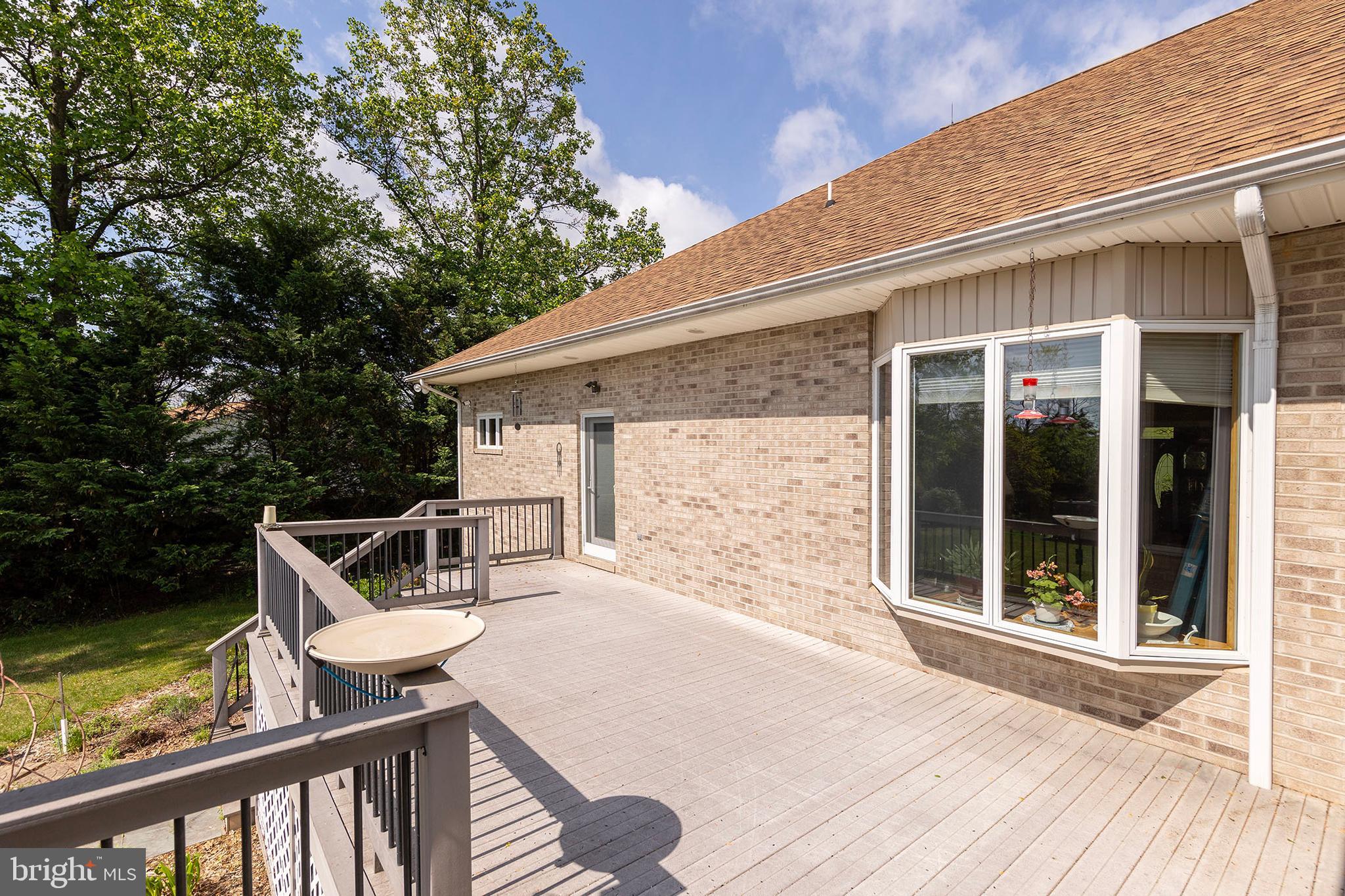 237 Aspen Trail Winchester, VA 22602 - Photo 48 of 69 a view of a patio with a table chairs and backyard