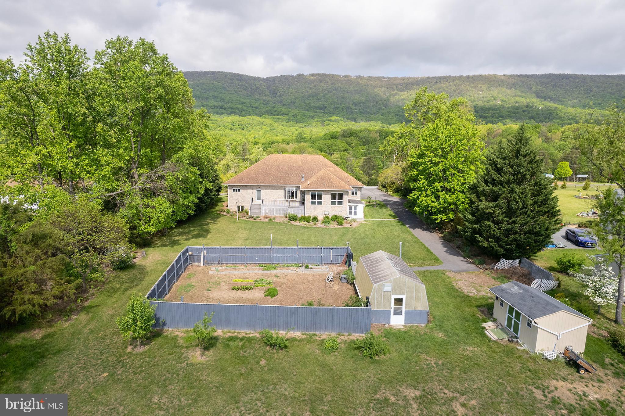237 Aspen Trail Winchester, VA 22602 - Photo 57 of 69 Fenced garden area & greenhouse