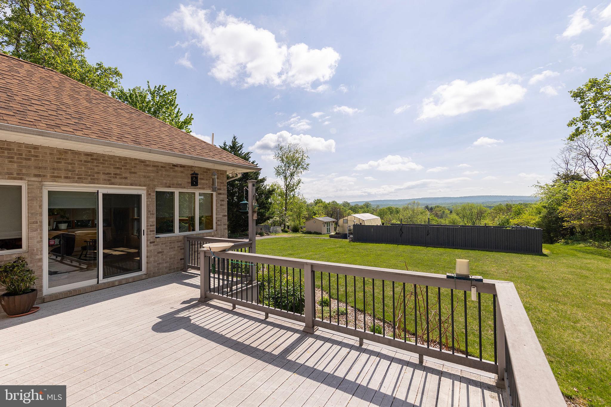 237 Aspen Trail Winchester, VA 22602 - Photo 7 of 69 a view of a chair and table on the terrace