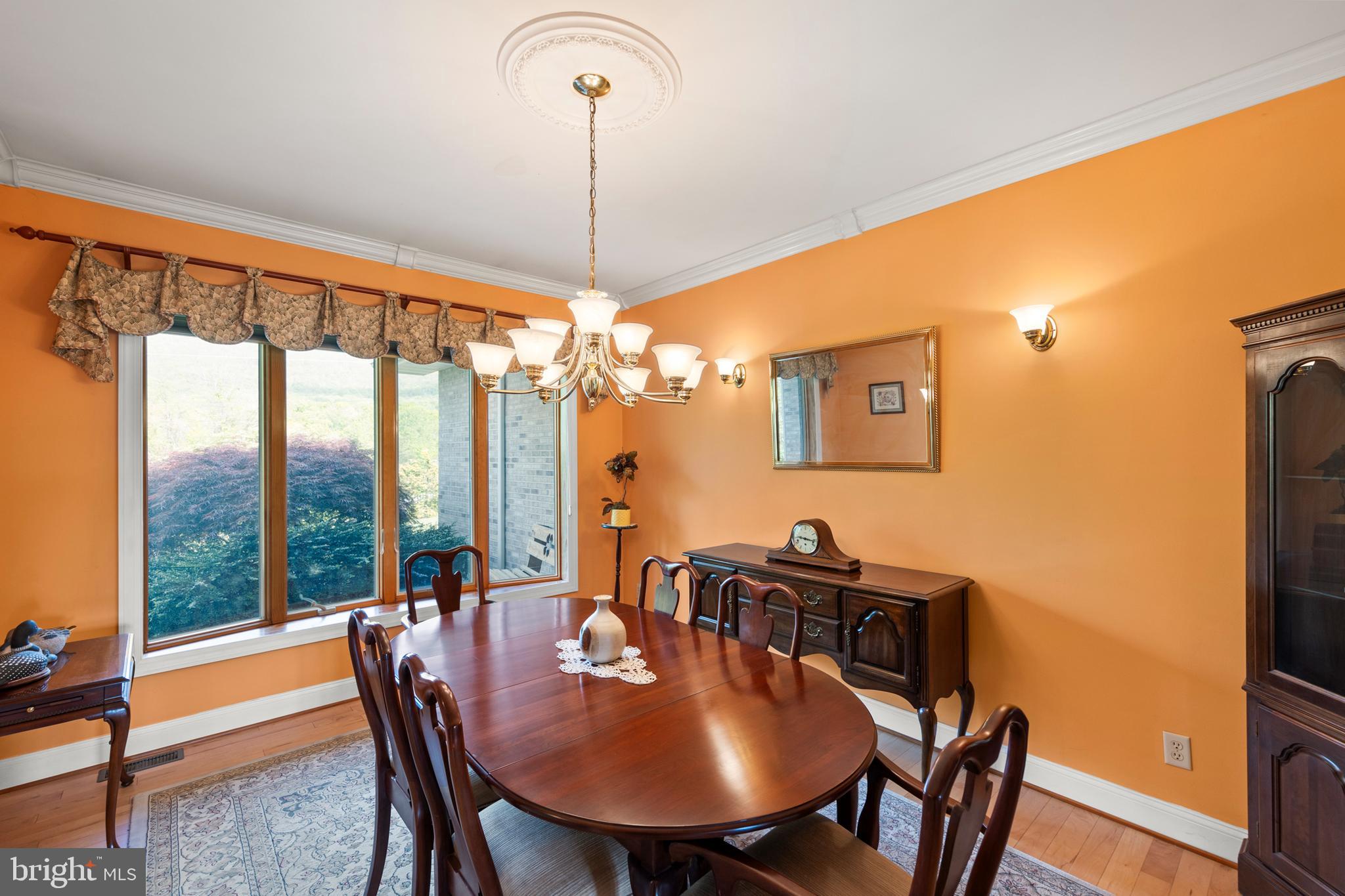 237 Aspen Trail Winchester, VA 22602 - Photo 9 of 69 a view of a dining room with furniture window and wooden floor