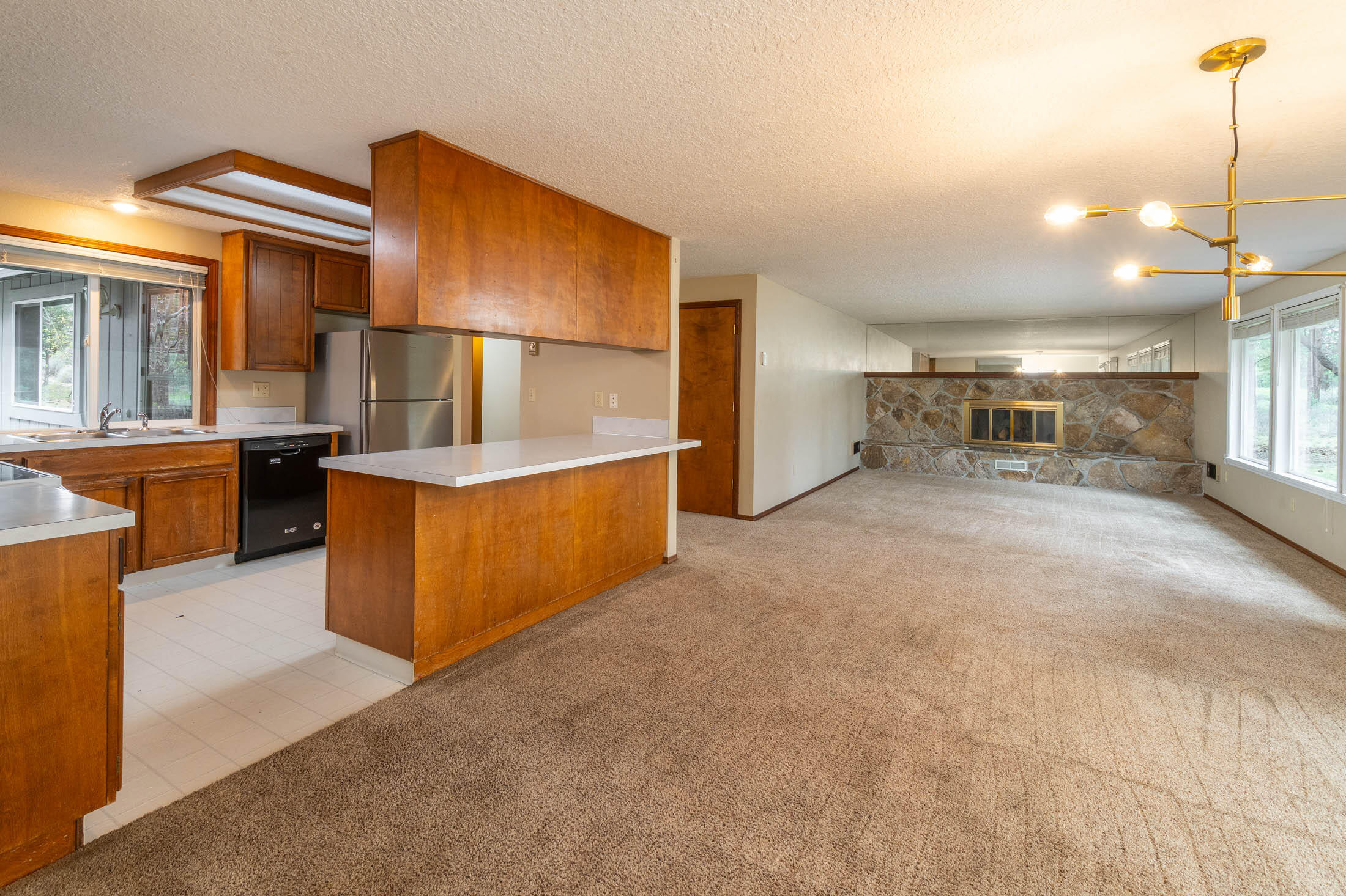 20316 Donkey Sled Road Bend, OR 97702 - Photo 16 of 50 a view of a kitchen with furniture and a kitchen