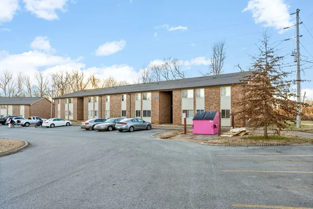 a view of a car park in front of house