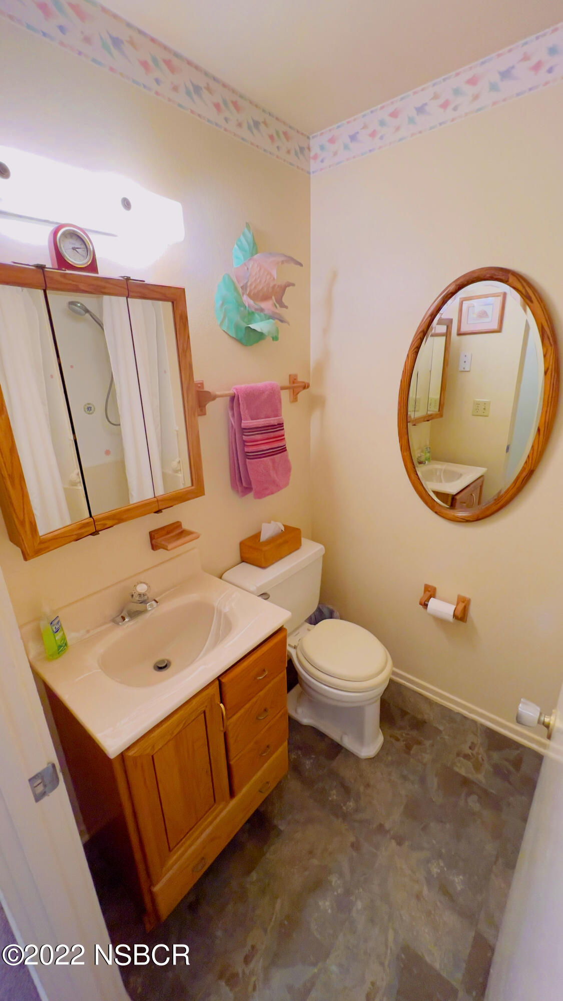 111 Mizar Place Lompoc, CA 93436 - Photo 19 of 31 a bathroom with a toilet a sink and a mirror