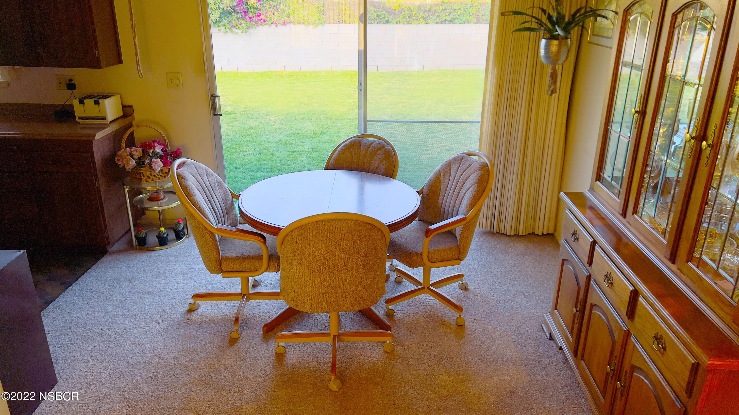 111 Mizar Place Lompoc, CA 93436 - Photo 9 of 31 a dining room with furniture and a floor to ceiling window