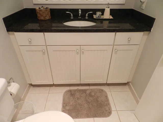 a bathroom with a sink and mirror