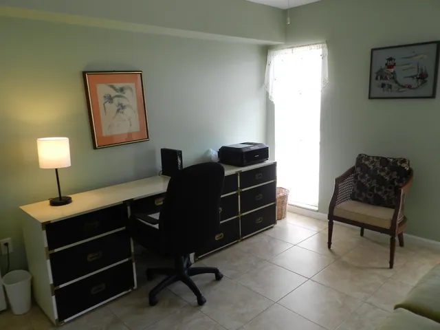 a livingroom with a workspace