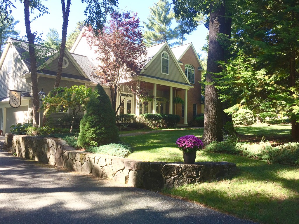 106 Flint Farm Road Middleton, MA 01949 - Photo 2 of 30 a front view of a house with garden