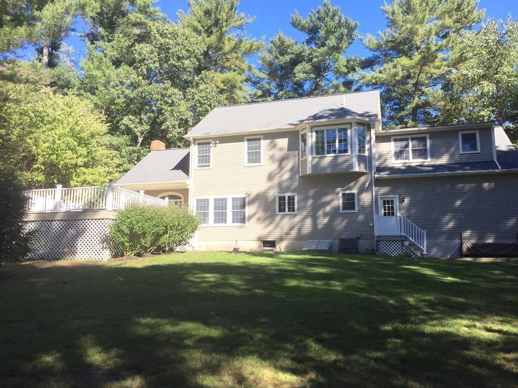 106 Flint Farm Road Middleton, MA 01949 - Photo 25 of 30 a front view of a house with a garden