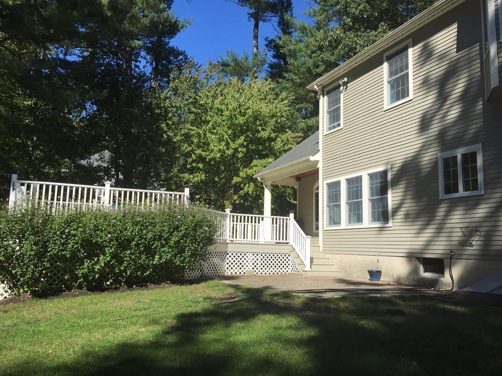 106 Flint Farm Road Middleton, MA 01949 - Photo 26 of 30 a front view of a house with a garden