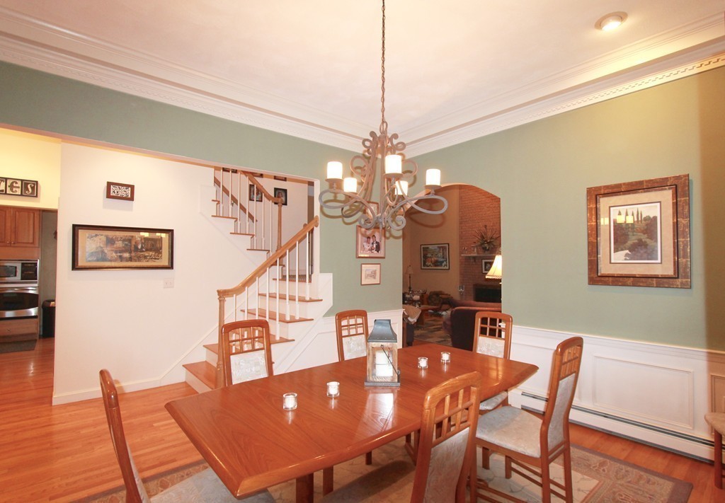 106 Flint Farm Road Middleton, MA 01949 - Photo 8 of 30 a view of a dining room with furniture and wooden floor