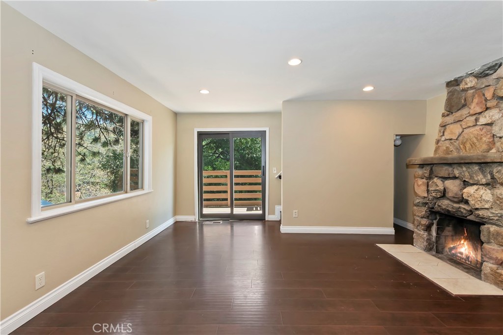 23739 Hillside Drive Crestline, CA 92325 - Photo 12 of 37 a view of an empty room with wooden floor and a window