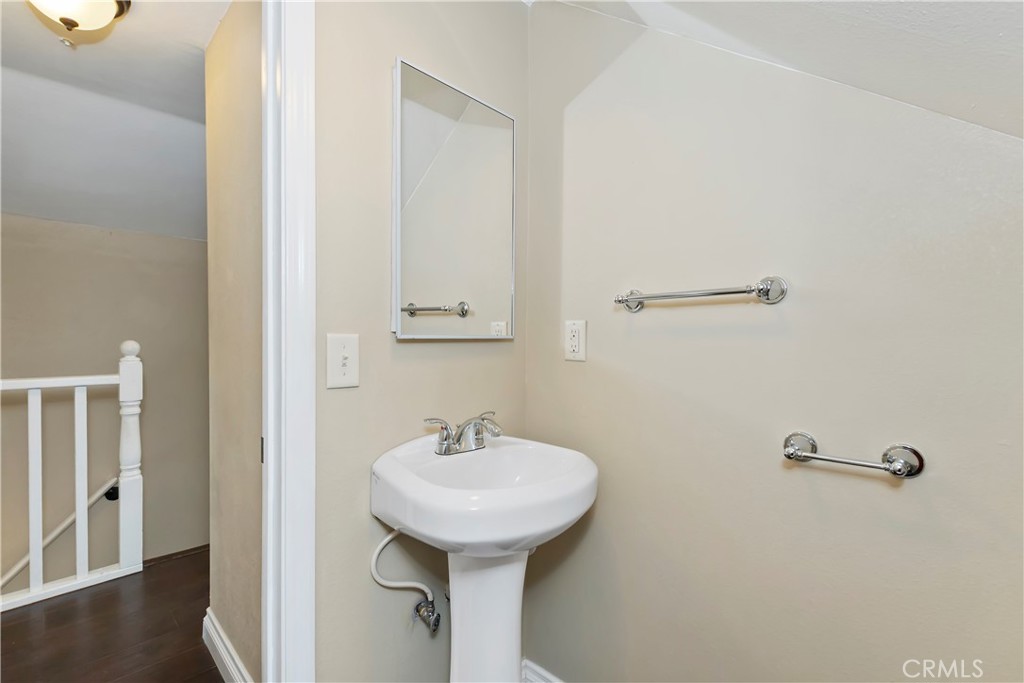 23739 Hillside Drive Crestline, CA 92325 - Photo 25 of 37 a bathroom with a sink a toilet and mirror