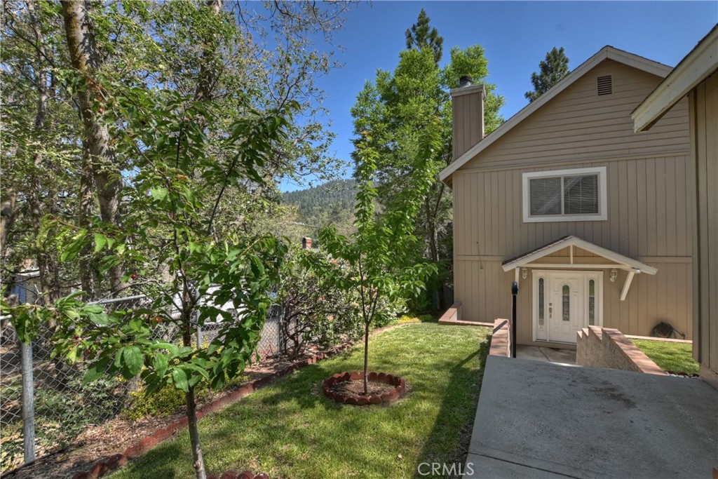 23739 Hillside Drive Crestline, CA 92325 - Photo 31 of 37 a front view of a house with garden