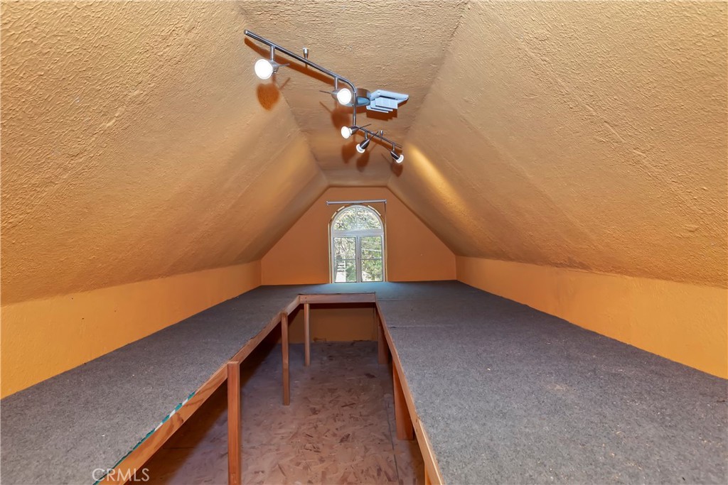 23739 Hillside Drive Crestline, CA 92325 - Photo 36 of 37 Finished attic with shelving