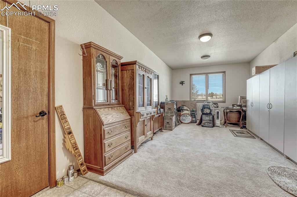 25106 Kobilan Road Calhan, CO 80808 - Photo 14 of 49 a bed room with furniture and a window