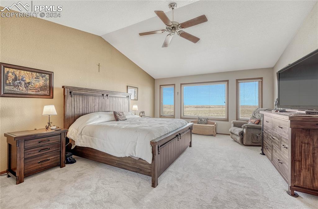 25106 Kobilan Road Calhan, CO 80808 - Photo 15 of 49 a bed room with a bed and a couch