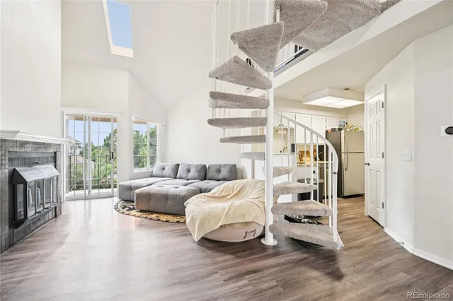 a bedroom with furniture and a fireplace