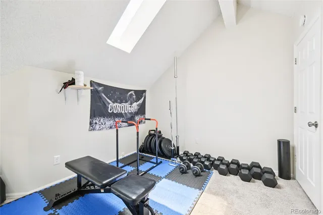 a living room with a couch and a window