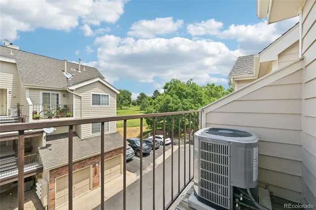 a balcony view with a garden