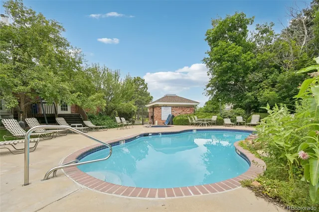 a view of a swimming pool with a lounge chairs
