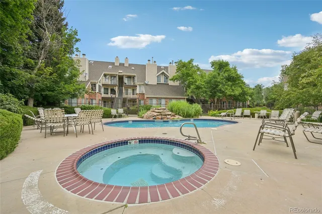a view of a swimming pool with a patio