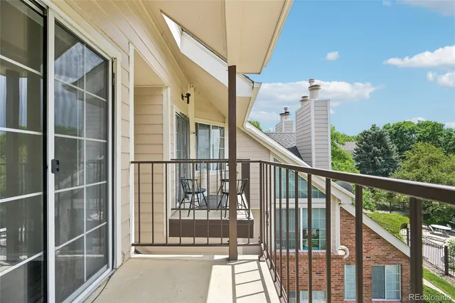 a view of balcony with a floor to ceiling window