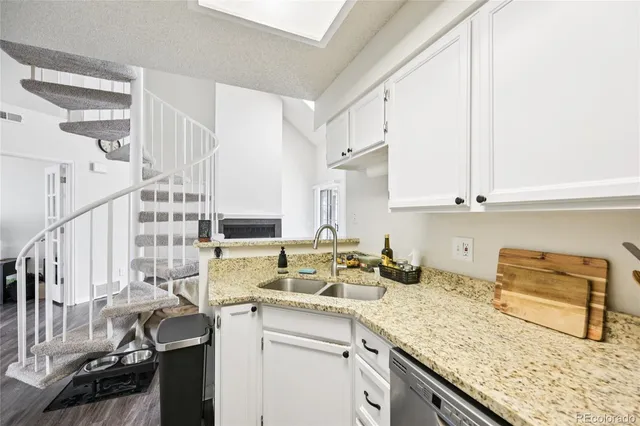 a kitchen with a sink and cabinets