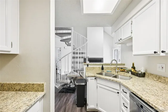 a kitchen with a sink stove and cabinets